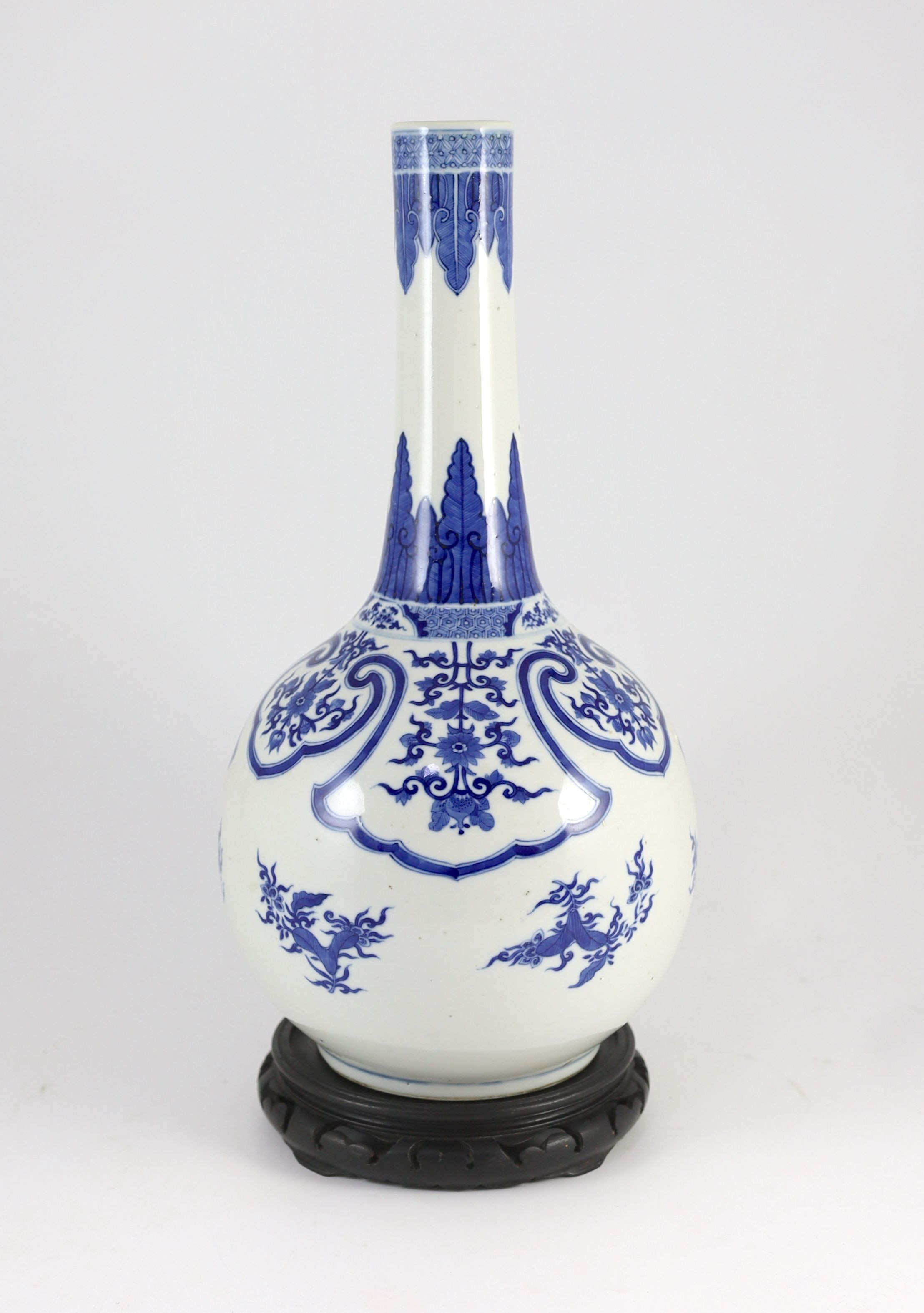 A large Chinese blue and white bottle vase, 19th century, 46cm high, wood stand, drilled hole to vase